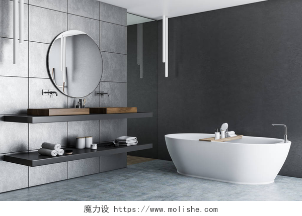 简约风格装修的浴室豪华浴室内有灰色瓷砖墙、混凝土地板、白色浴缸和双水槽, 上面挂着一张圆形镜子。3d 渲染